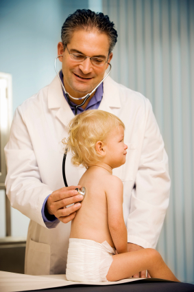 doctor examing young child